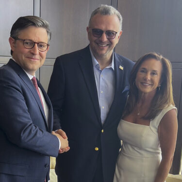 This image provided by John Akouri, shows, from left, House Speaker Mike Johnson, R-La., Massad Boulos, Tiffany Trump's father-in-law, and Rep. Lisa McClain, R-Mich., posing for a photo June 1, 2024, in Waterford Township, Mich. (AP Photo/John Akouri)