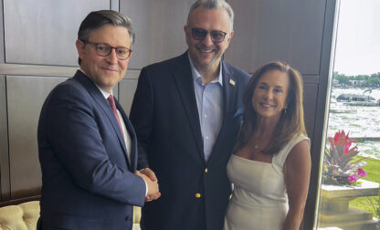 This image provided by John Akouri, shows, from left, House Speaker Mike Johnson, R-La., Massad Boulos, Tiffany Trump's father-in-law, and Rep. Lisa McClain, R-Mich., posing for a photo June 1, 2024, in Waterford Township, Mich. (AP Photo/John Akouri)