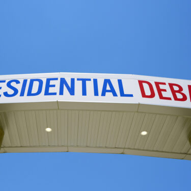 Signage for the upcoming presidential debate is seen at the media file center near the CNN Techwood campus in Atlanta on Tuesday, June 25, 2024. A new poll finds that most U.S. adults plan to watch or listen to some element of Thursday's presidential debate. (AP Photo/Pablo Martinez Monsivais)