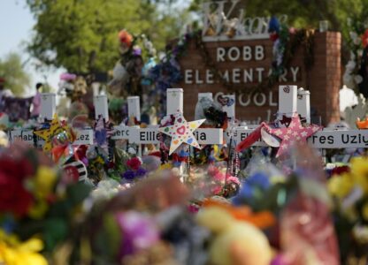 Crosses flowers and other memorabilia form